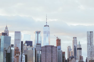 Modern buildings in city against sky