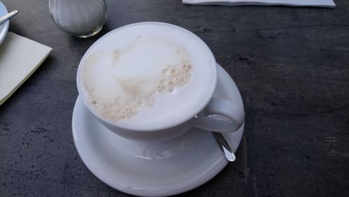 High angle view of coffee cup on table