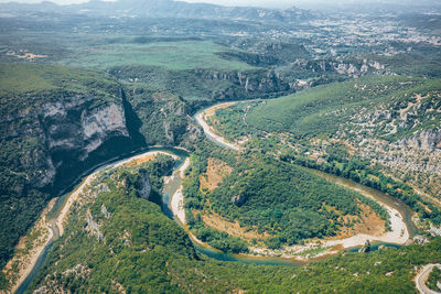 Aerial view of river flowing on landscape