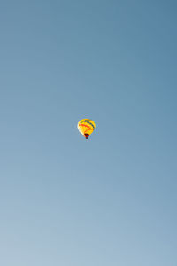 Low angle view of hot air balloon against clear sky