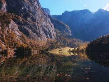 Scenic view of lake and mountains against sky