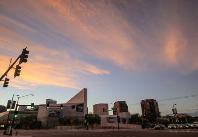 Low angle view of buildings against sky during sunset