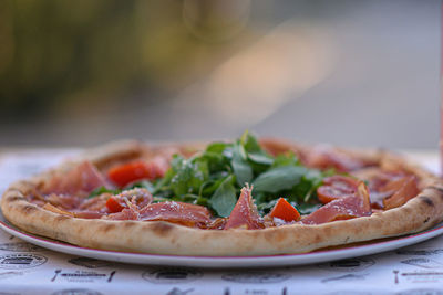 Close-up of pizza in plate on table