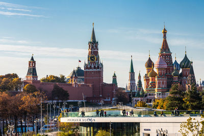 Panoramic view of buildings in city against sky