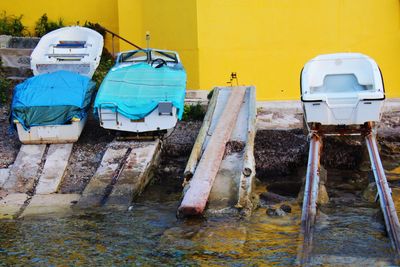 View of old boat against blue wall