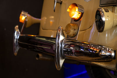 Close-up of illuminated faucet in kitchen