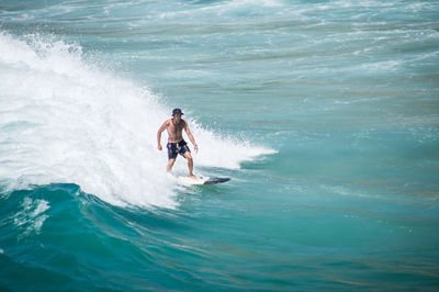 Man surfing in sea