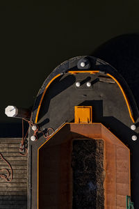 Low angle view of illuminated building against sky at night