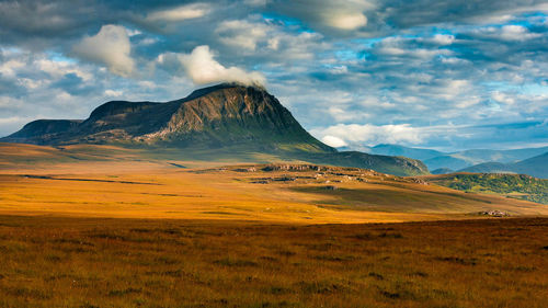 Scenic view of dramatic sky over landscape