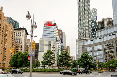 City street and buildings against sky