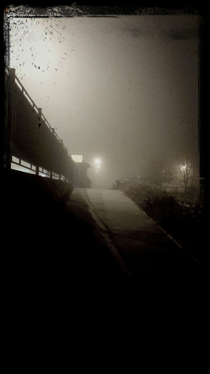 night, illuminated, street light, built structure, architecture, building exterior, lighting equipment, dark, transportation, sky, copy space, electricity, clear sky, street, no people, road, auto post production filter, outdoors, city, dusk