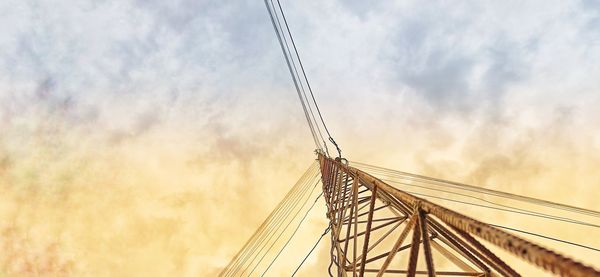 Low angle view of bridge against sky during sunset