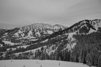 Scenic view of mountains against sky during winter