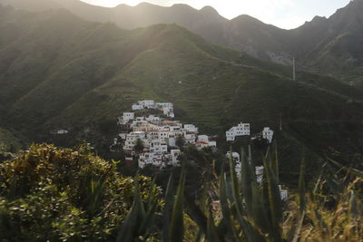 High angle view of townscape and mountains