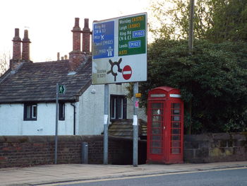 Road sign in front of building