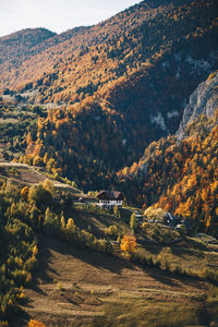 High angle view of field and mountains against sky