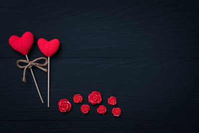 High angle view of red heart shape decoration on black background