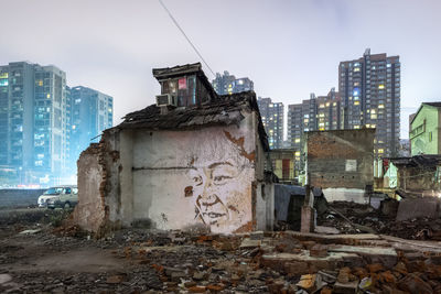 Old buildings against sky in city