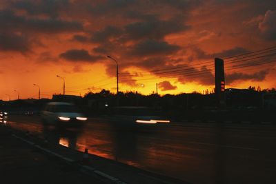 Road against cloudy sky at sunset