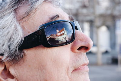 Close-up portrait of woman wearing sunglasses