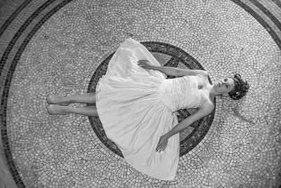 High angle view of woman lying on floor