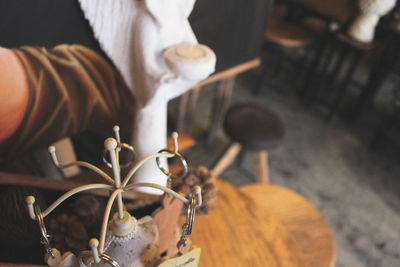 Close-up high angle view of hand pouring drink