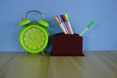 Close-up of clock on table