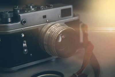 Close-up of camera on table