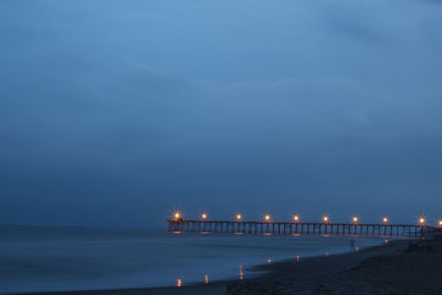 Scenic view of sea against sky at night