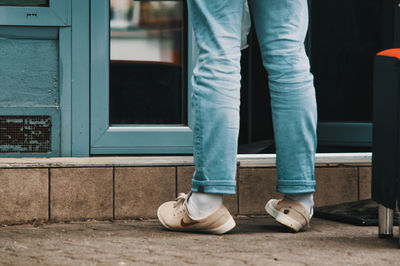 Low section of man standing on floor