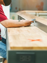 Midsection of man working in container
