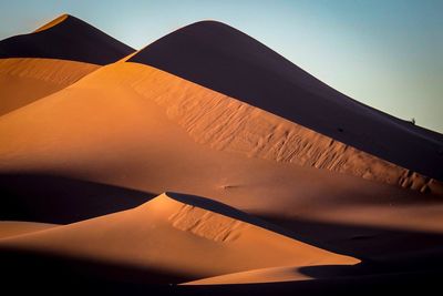 Scenic view of desert against clear sky