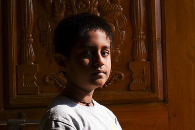 Portrait of boy looking away at entrance