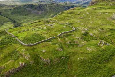 Aerial of hardknott roman fort is an archeological site, the remains of the roman fort mediobogdum, located on the western side of the hardknott pass in the english county of cumbria