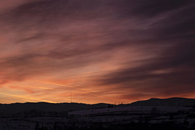 Scenic view of dramatic sky during sunset