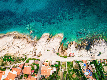 Aerial view of houses by seashore