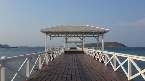 Pier over sea against clear sky