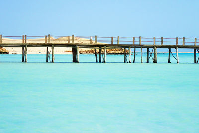 View of swimming pool against clear blue sky