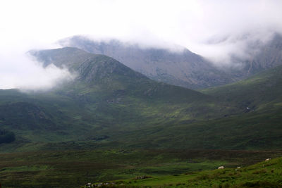 Scenic shot of mountain range in foggy weather