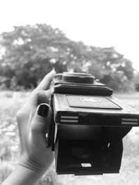 Close-up of hand holding camera