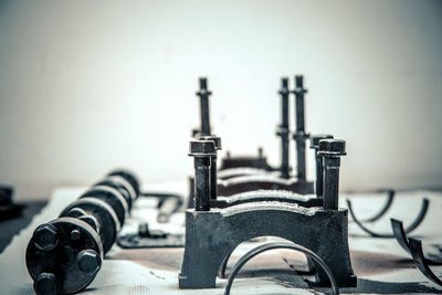 Close-up of old machinery on table
