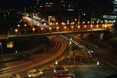 High angle view of light trails on road at night