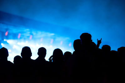 Silhouette people at music concert