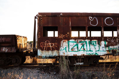 Train on railroad tracks against clear sky