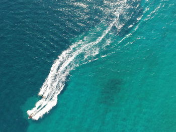 Aerial view of boat sailing in sea