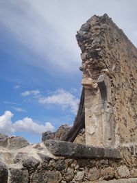 Low angle view of old ruins against sky