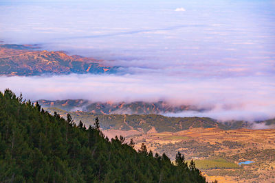 High angle view of cloud filling large valley against sky