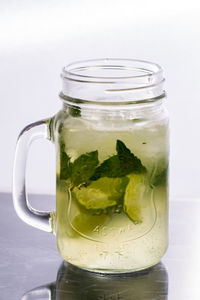 Close-up of drink in glass jar on table
