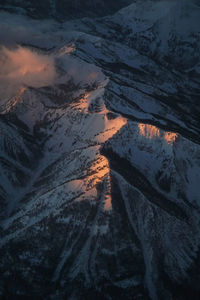 High angle view of snowcapped mountain against sky