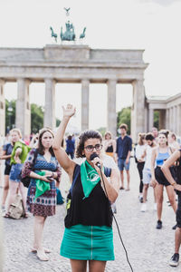 Group of people in front of historical building